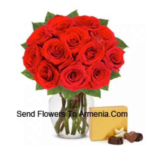 11 Red Roses With Some Ferns In A Glass Vase Accompanied With An Imported Box Of Chocolates