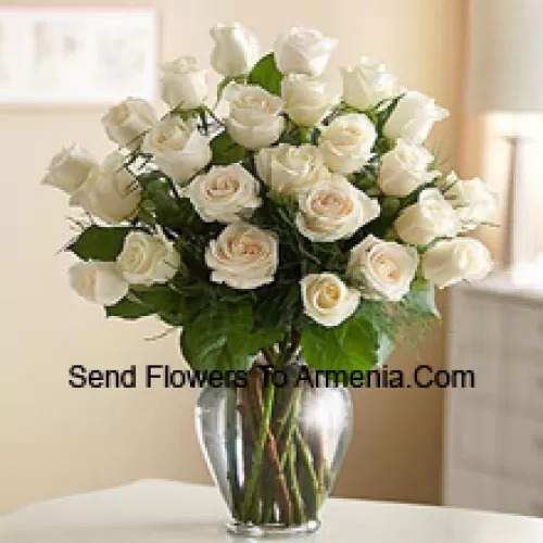 25 White Roses With Some Ferns In A Glass Vase