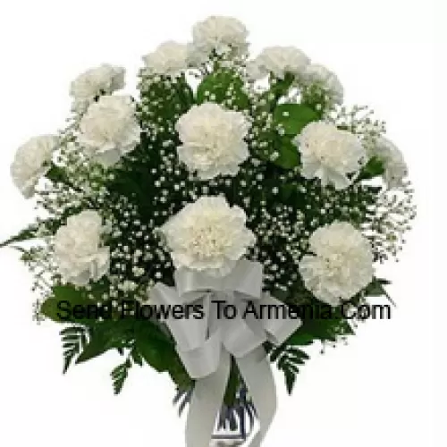 19 White Carnations With Seasonal Fillers In A Glass Vase