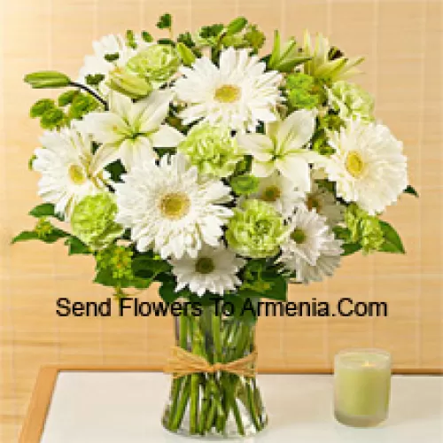 White Gerberas, White Alstroemeria And Other Assorted Seasonal Flowers Arranged Beautifully In A Glass Vase