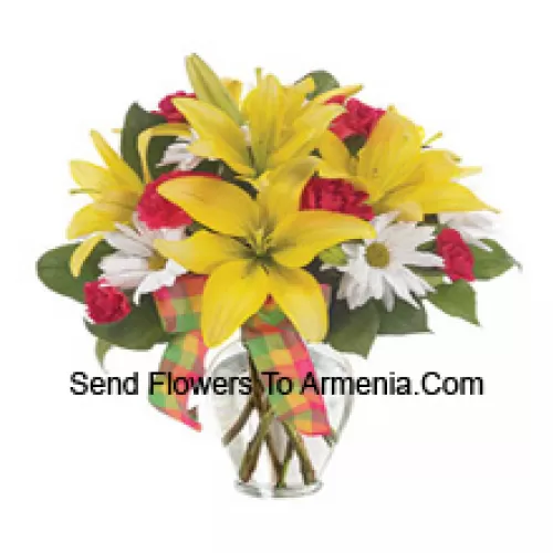 Yellow Lilies, Red Carnations And Suitable Seasonal White Flowers Arranged Beautifully In A Glass Vase