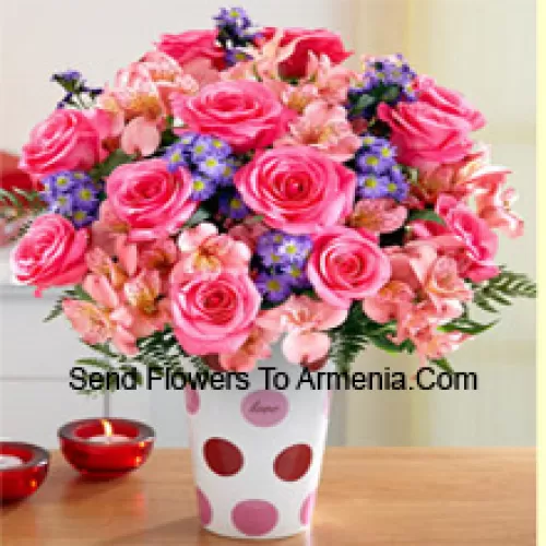 Pink Roses, Pink Orchids And Assorted Purple Flowers Arranged Beautifully In A Glass Vase