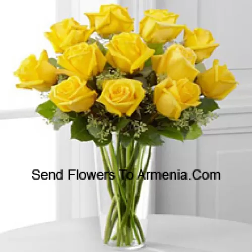 11 Yellow Roses With Some Ferns In A Glass Vase