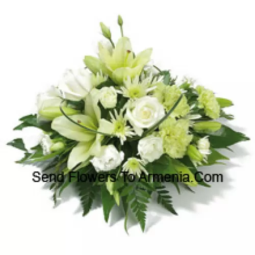 A Beautiful Arrangement Of White Roses, White Carnations, White Lilies And Assorted White Flowers With Seasonal Fillers