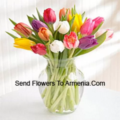 Mixed Colored Tulips In A Glass Vase - Please Note That In Case Of Non-Availability Of Certain Seasonal Flowers The Same Will Be Substituted With Other Flowers Of Same Value