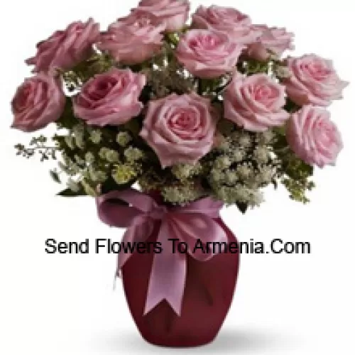 11 Pink Roses With Assorted White Fillers In A Glass Vase