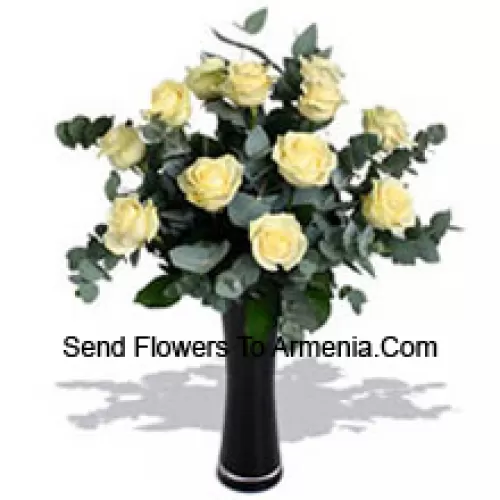 11 White Roses With Some Ferns In A Vase