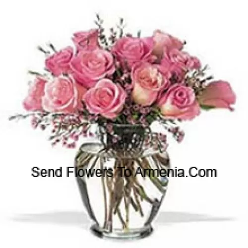 Bunch Of 11 Pink Roses With Some Ferns In A Vase