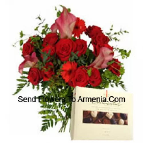 Red Gerberas And Red Roses In A Vase Along With A Box Of Chocolate