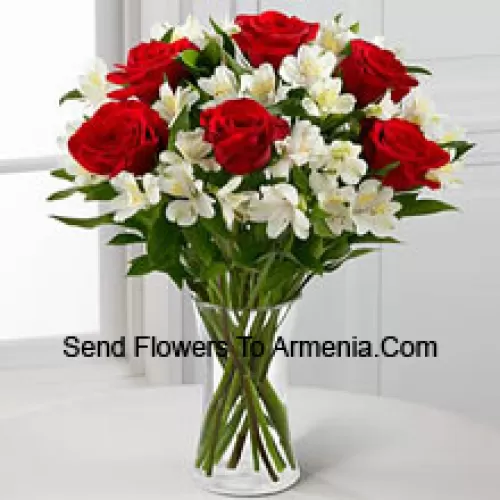 7 Red Roses With Assorted White Flowers And Fillers In A Glass Vase