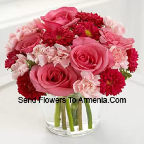 7 Pink Roses, 10 Red Colored Daisies And 10 Pink Colored Carnations In A Glass Vase