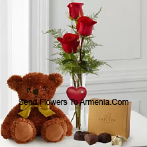 Three Red Roses With Some Ferns In A Vase, A Cute Brown 10 Inches Teddy Bear And A Box Of Godiva Chocolates. (We reserve the right to substitute the Godiva chocolates with chocolates of equal value in case of non-availability of the same. Limited Stock)