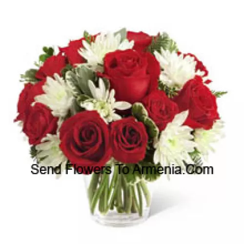 This Bouquet is a charming display of holiday beauty and winter warmth. Rich red roses and spray roses pop against white chrysanthemums, assorted Christmas greens and eucalyptus, arranged in a round clear glass vase to create a gift that will spread the goodwill of the season to your special recipient. (Please Note That We Reserve The Right To Substitute Any Product With A Suitable Product Of Equal Value In Case Of Non-Availability Of A Certain Product)