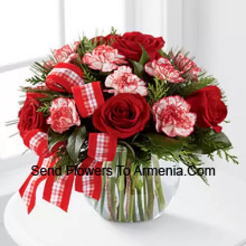 Send warm wishes and bright sentiments for a wonderful holiday season! Rich red roses and peppermint carnations are delicately arranged with holiday greens to create a festive display. Arriving in a clear glass bubble bowl and accented with a red and white plaid ribbon, this arrangement is full of seasonal sophistication. (Please Note That We Reserve The Right To Substitute Any Product With A Suitable Product Of Equal Value In Case Of Non-Availability Of A Certain Product)