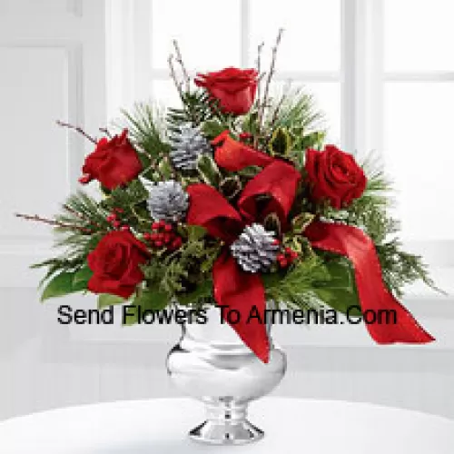 Highly elegant and bursting with your merriest wishes, this bouquet will create the perfect holiday gift. Rich red roses are vibrant and bright arranged with variegated holly, assorted holiday greens, silver pinecones and branches, all perfectly accented with a faux cardinal and designer red ribbon. Presented in a silver pedestal vase, this bouquet will add to the joy and festivities of their holiday season with each gorgeous bloom. (Please Note That We Reserve The Right To Substitute Any Product With A Suitable Product Of Equal Value In Case Of Non-Availability Of A Certain Product)