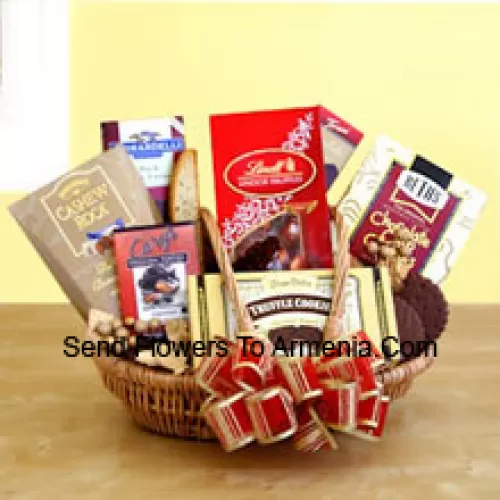 Satisfy her sweet tooth this year with a gift dedicated to chocolate indulgence! Our wicker basket comes brimming with a vast array of gourmet treats, all celebrating the many reasons to love chocolate. Its sweet excess includes Beth's chocolate chip cookies, English toffee, Chocolate truffle cookies, biscotti, Lindt truffles, Cashew Roca and a Ghirardelli chocolate bar. (Please Note That We Reserve The Right To Substitute Any Product With A Suitable Product Of Equal Value In Case Of Non-Availability Of A Certain Product)